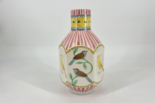 Decorative ceramic vase with pink and white stripes and bird-on-vine motifs in blue, green, and yellow panels.