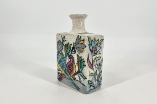 Ceramic vase with a crackled glaze and a colorful bird and botanical design on its surface for decorative display.