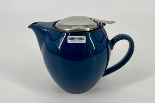 Blue ceramic teapot with a silver lid and 'Bee House Made in Japan' label, set against a white background.