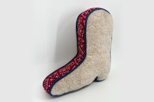 Cozy beige fleece slipper with a red patterned trim and blue edging, shown on its side.