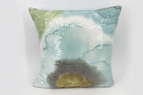 Decorative sequin pillow in pastel blue and green tones with a soft, reflective surface