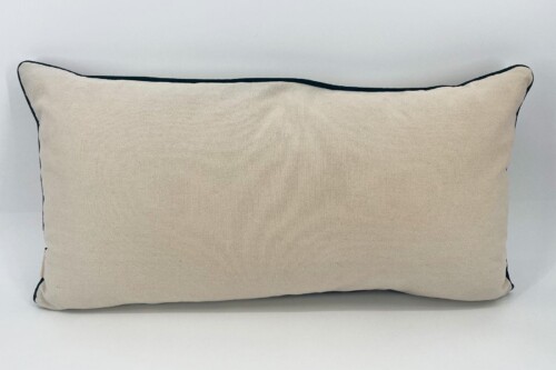 Beige rectangular decorative throw pillow with dark navy piping along the edges on a white background