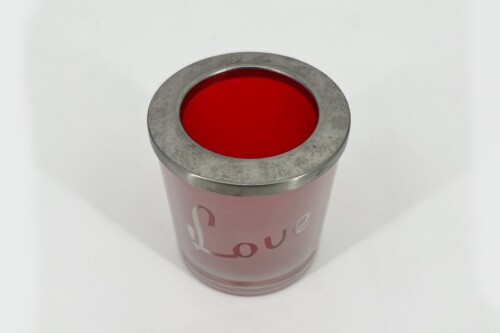 Close-up of a pink lipstick tube with bright red lipstick exposed at the top and a metal ring around the opening.