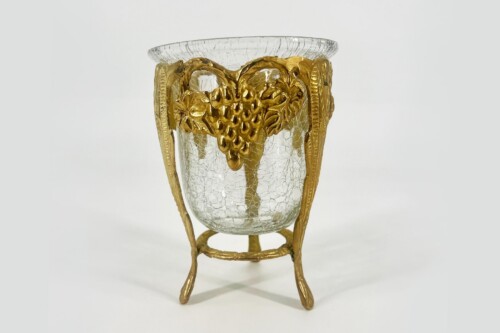 Cracked glass goblet with a gold ornate metal mount featuring vine-like details and a tripod base.