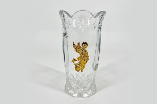 Crystal vase with a gold angel motif on the front, intricate cut-glass pattern, clear glass, tall shape.