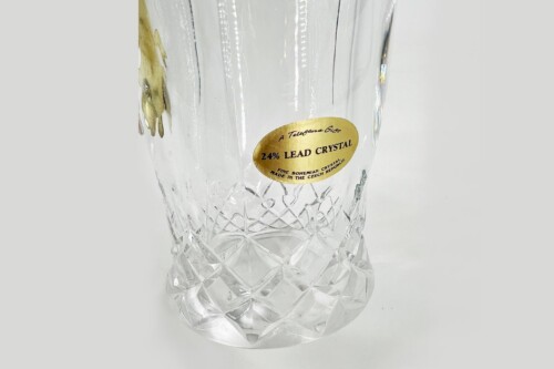 Crystal glass with a gold label reading '24% LEAD CRYSTAL' and fine cut facets on the base