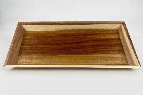 Rectangular wooden tray with dark-stained bottom and lighter sides, seen from above.