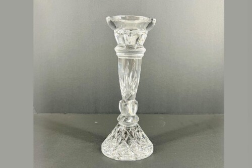 Clear crystal candle holder with a tall, faceted stem and a wide top designed to hold a candle.