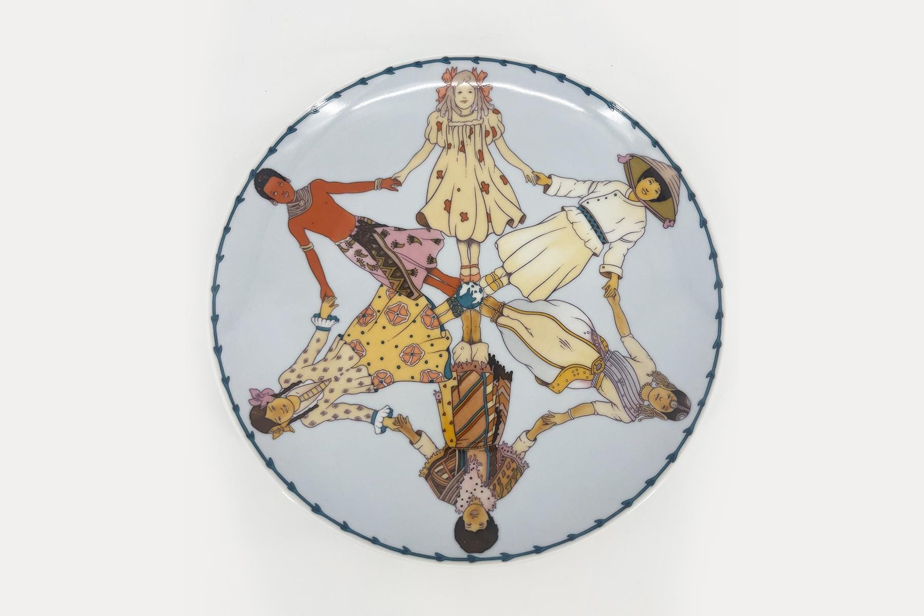 Round decorative plate featuring six people in vintage clothing forming a circle by holding hands; blue scalloped border around the rim.