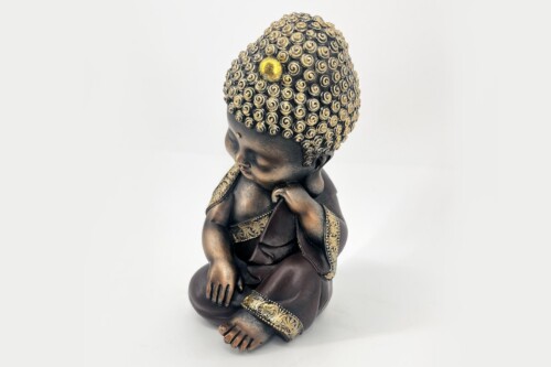 Bronze Buddha statue in a seated meditative pose with ornate gold accents and curly hair beads.