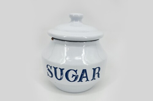 White ceramic sugar jar with a matching lid and blue 'SUGAR' lettering on the front.