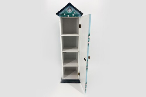 Tall white wooden cabinet with four open shelves, topped by a small decorative pitched roof with a floral motif.