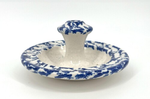 Close-up of a blue-and-white ceramic jar with a rounded lid knob.