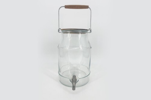 Clear glass water dispenser with a metal wire bail, wooden top handle, and a small spout at the base front.