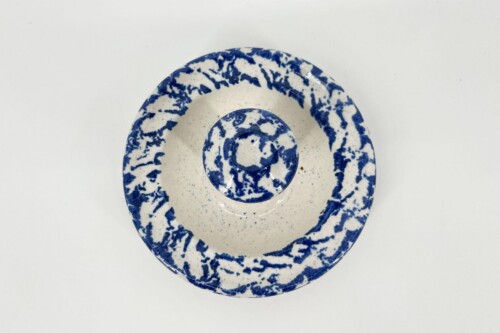 Top-down view of a white ceramic plate with a blue marbled rim and a matching inner circle dish inside.