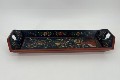 Wooden decorative tray with dark blue background, red trim, and hand-painted floral pattern, featuring two cutout handles at ends