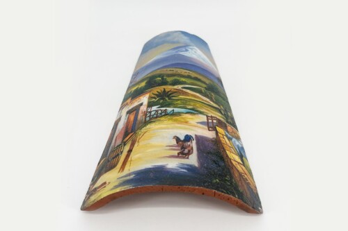 Curved ceramic vase with a pastoral landscape painting of a dirt path, fence, and hills in the distance.