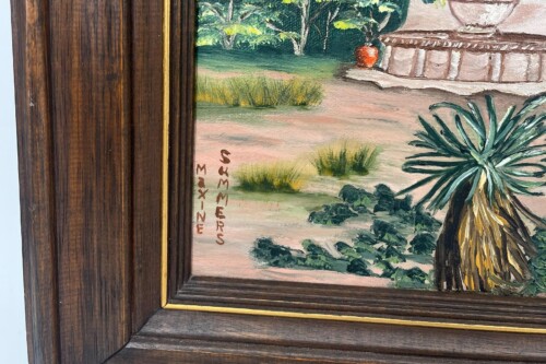 Close-up of a painting's lower-left corner in a dark wooden frame with a thin gold inner edge; a vertical artist signature runs along the left edge of the painting.