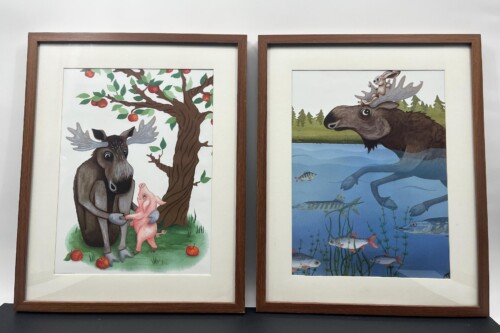 Pair of framed prints: left shows a moose with a pink piglet under an apple tree; right shows a moose swimming underwater with a rabbit on its antlers and fish nearby.
