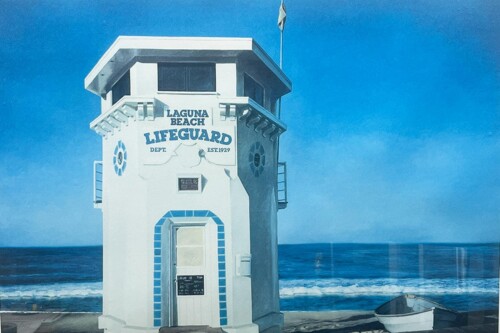 White lifeguard tower by the ocean at Laguna Beach; sign reads 'Laguna Beach Lifeguard Dept. Est. 1929'.
