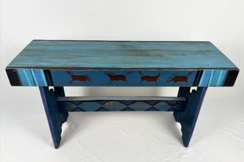 Blue wooden bench with hand-painted brown horse silhouettes along the side panels.