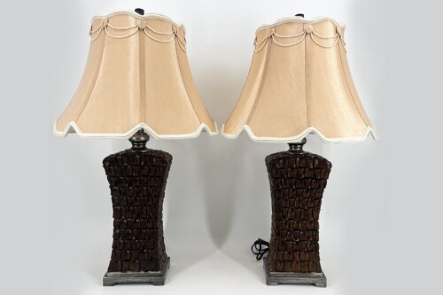 Two matching table lamps with cream-beige scalloped lampshades and dark textured bases.