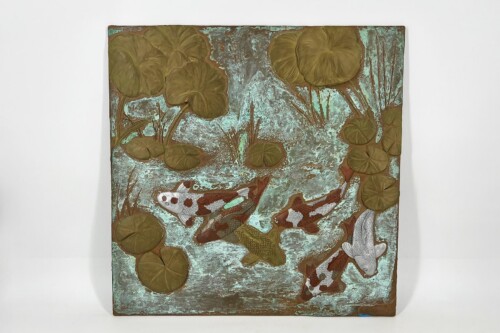 Relief panel depicting koi fish swimming among lotus leaves on a turquoise textured pond surface.