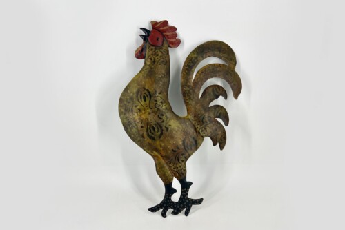 Decorative metal rooster sculpture with ornate swirling patterns, standing on black feet against a light background.