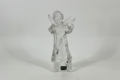 Clear crystal glass angel figurine with folded wings, standing upright on a base with a green Mikasa label on the bottom.
