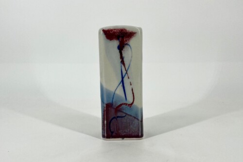 Tall rectangular ceramic vase with abstract red and blue brushstrokes on a white glaze.