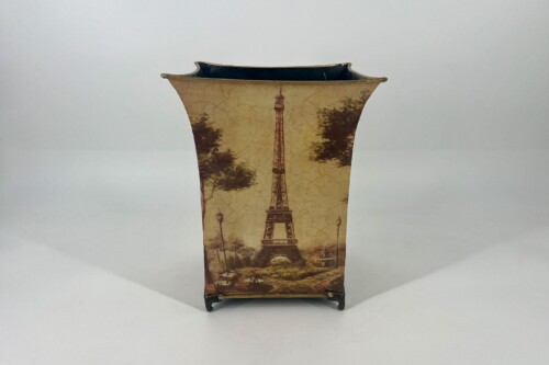 Decorative vintage vase with a Paris scene showing the Eiffel Tower and lampposts on a small metal stand.