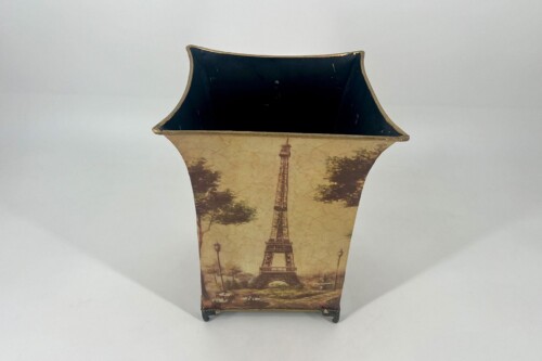 Decorative ceramic vase with a vintage Paris scene showing the Eiffel Tower and a dark interior opening.