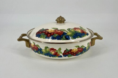 White ceramic tureen with brass handles and floral fruit motif (grapes, berries, and apples) on lid and body, decorative kitchenware.
