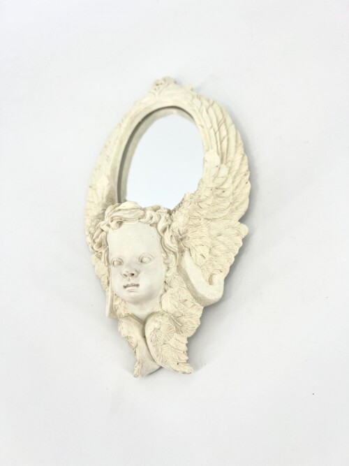 White ornamental mirror frame shaped like an oval with a cherub head and feathered wings, shown from the side.