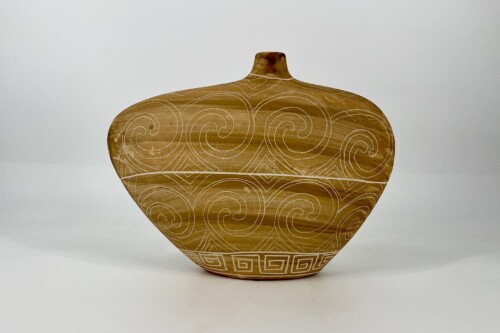 Ceramic vase with a wide rounded body and top neck, decorated with white spiral patterns on a light brown glaze, set against a neutral background.