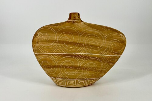 Brown ceramic vase with white spiral patterns and a narrow neck.