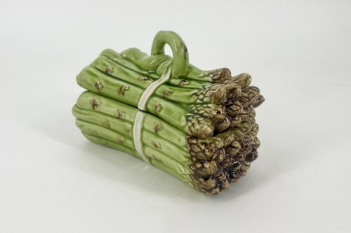 Ceramic sculpture of a bundle of green asparagus tied with a white band