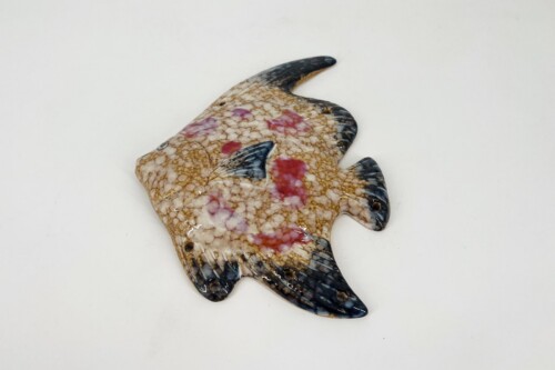 Stingray-shaped ceramic dish with crackled beige glaze and pink patches.