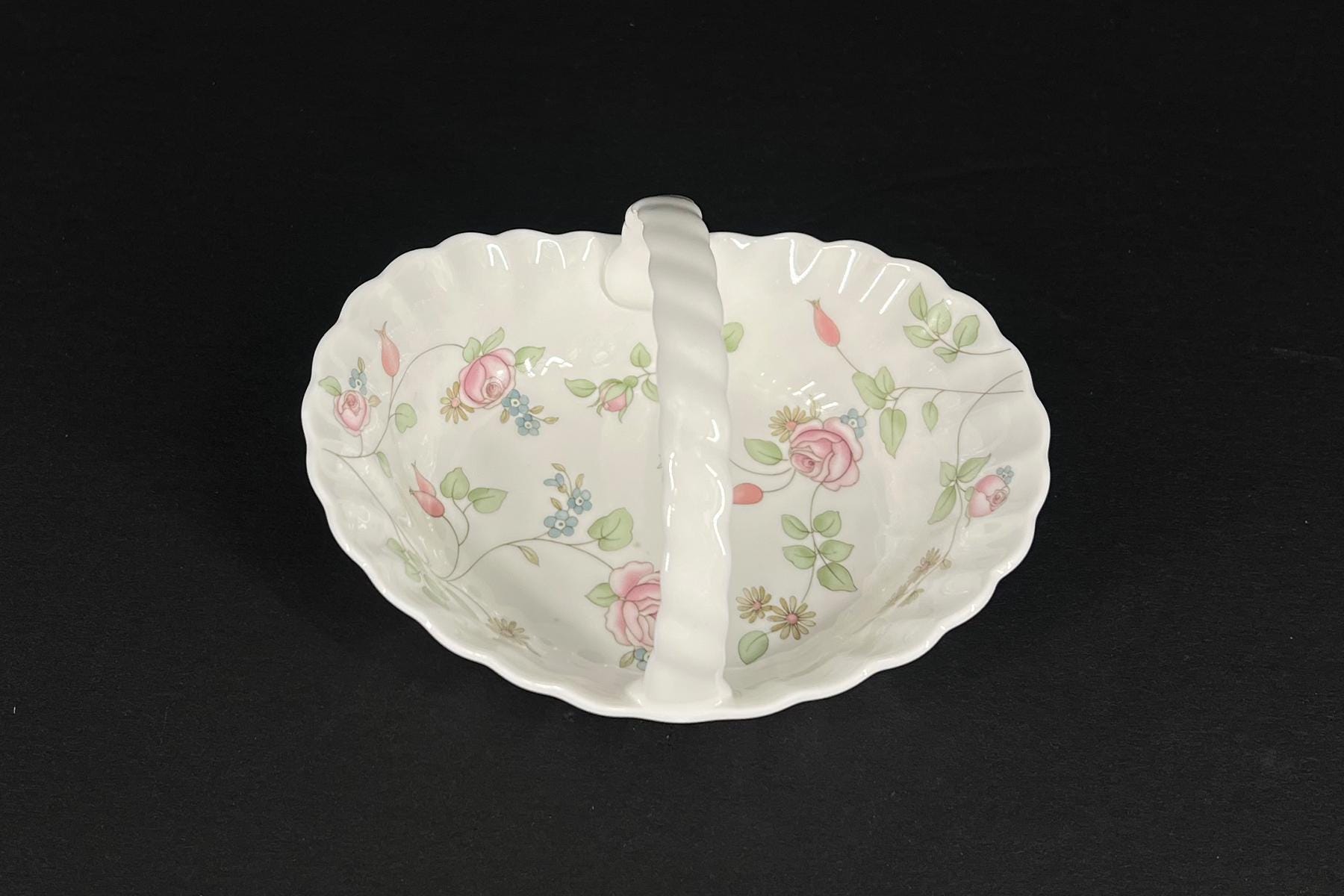 White porcelain divided serving dish with pink rose and leaf pattern, featuring a central raised divider across the bowl's interior